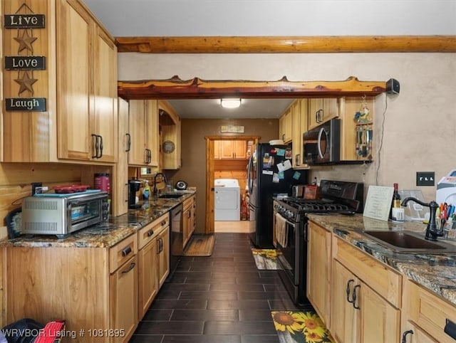 161129 N 4550th Rd, Talihina, OK 74571 - kitchen featuring gas range oven, washer / dryer, dishwasher, dark stone counters, and beamed ceiling