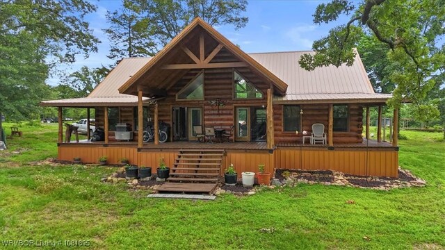 161129 N 4550th Rd, Talihina, OK 74571 - rear view of property with log exterior, a yard, a metal roof, and a wooden deck