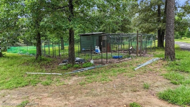161129 N 4550th Rd, Talihina, OK 74571 - view of jungle gym with an outbuilding, view of scattered trees, and exterior structure