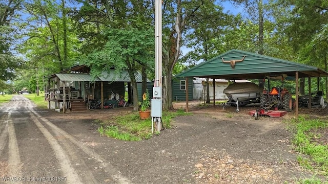 161129 N 4550th Rd, Talihina, OK 74571 - view of parking with a carport and driveway