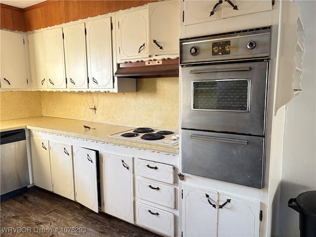 kitchen featuring stainless steel appliances, white cabinetry, and dark hardwood / wood-style floors