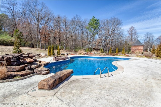 outdoor pool with a patio area