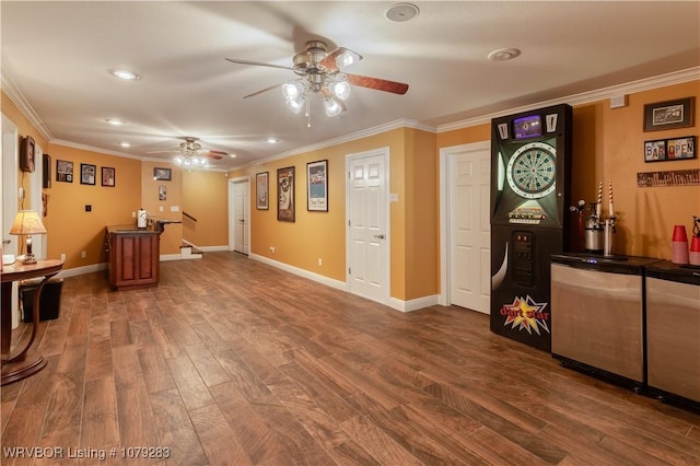 interior space with dark wood-style floors, crown molding, baseboards, and a ceiling fan