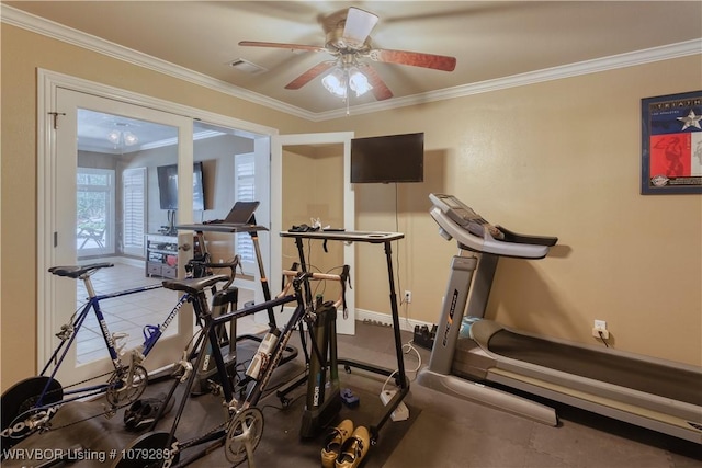 workout area featuring visible vents, crown molding, baseboards, and ceiling fan