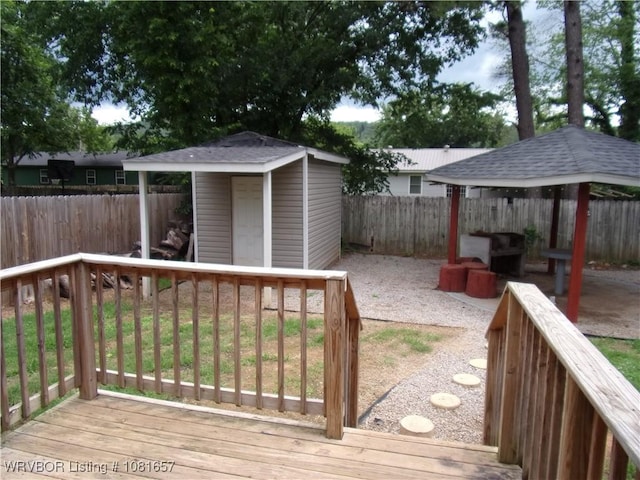 818 N 3rd St, Ozark, AR 72949 - deck featuring a gazebo, a storage shed, and a fenced backyard