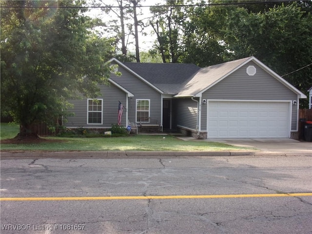 818 N 3rd St, Ozark, AR 72949 - single story home with an attached garage, concrete driveway, and a front yard