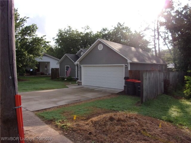 818 N 3rd St, Ozark, AR 72949 - garage with concrete driveway