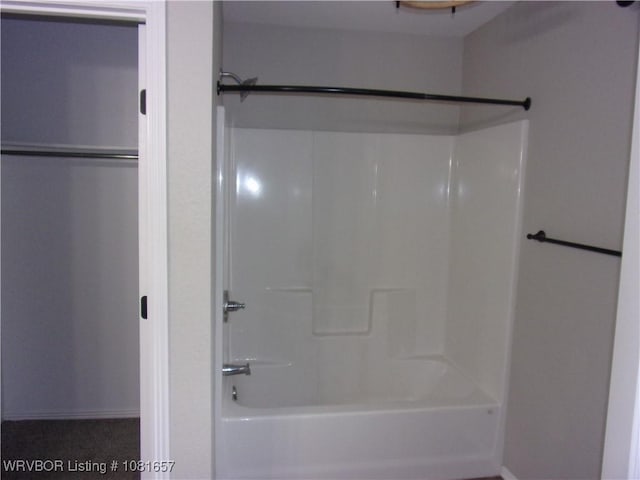 818 N 3rd St, Ozark, AR 72949 - bathroom featuring bathing tub / shower combination and baseboards