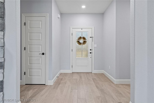 foyer with light hardwood / wood-style floors