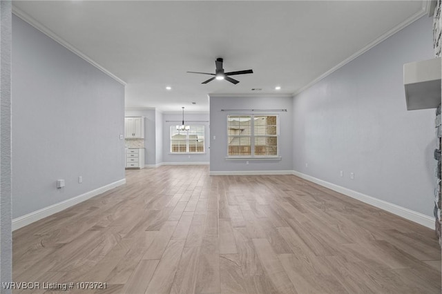 unfurnished living room with ceiling fan with notable chandelier, crown molding, and light hardwood / wood-style flooring