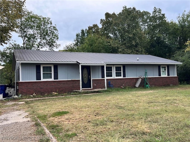 ranch-style home with a front lawn