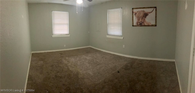 carpeted empty room featuring ceiling fan