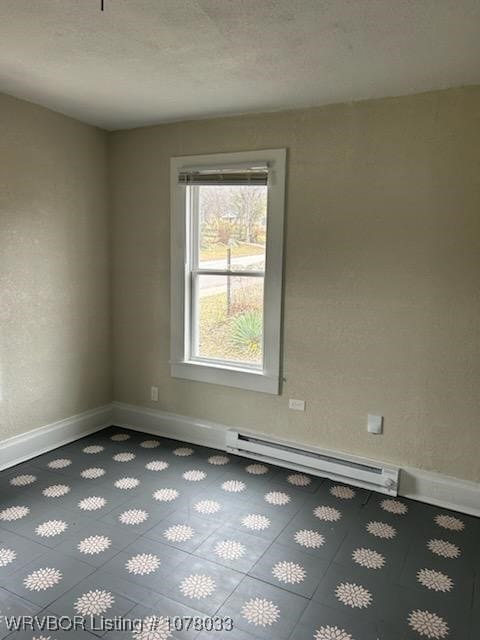 empty room with a baseboard radiator