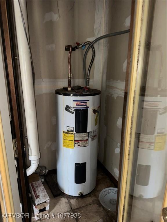 utility room featuring water heater