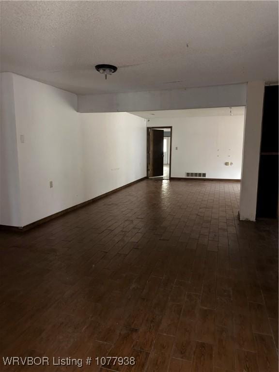 spare room with a textured ceiling