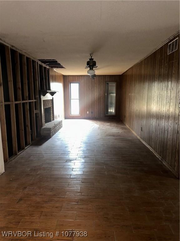 unfurnished living room featuring a fireplace