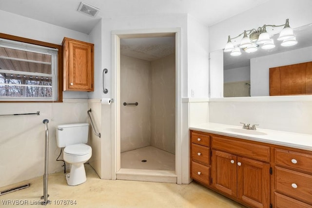 bathroom with a shower, vanity, and toilet