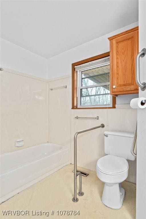 bathroom with tub / shower combination and toilet