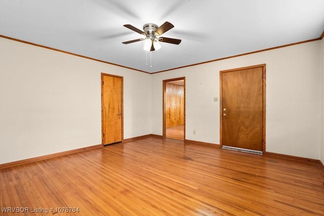 empty room featuring crown molding, ceiling fan, and light wood-type flooring