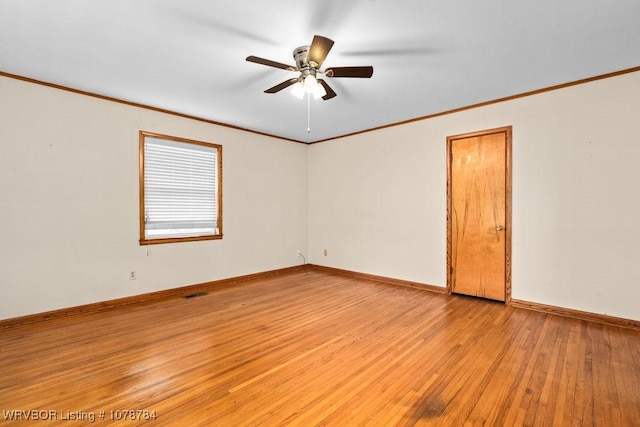 spare room featuring ornamental molding, ceiling fan, and light hardwood / wood-style flooring