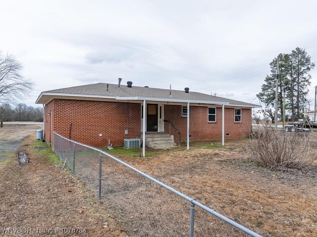 back of house featuring central air condition unit