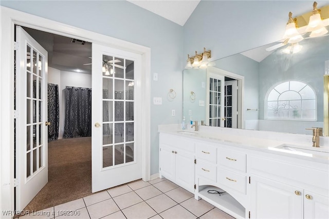 5805 Meadow Brook Dr, Fort Smith, AR 72916 - full bath featuring a ceiling fan, double vanity, vaulted ceiling, and tile patterned flooring