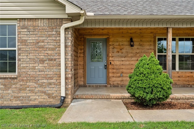 8601 Corona Ct, Uniontown, AR 72955 - property entrance featuring a shingled roof and brick siding