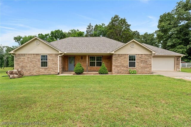 8601 Corona Ct, Uniontown, AR 72955 - ranch-style house featuring concrete driveway, a front lawn, a garage, and brick siding