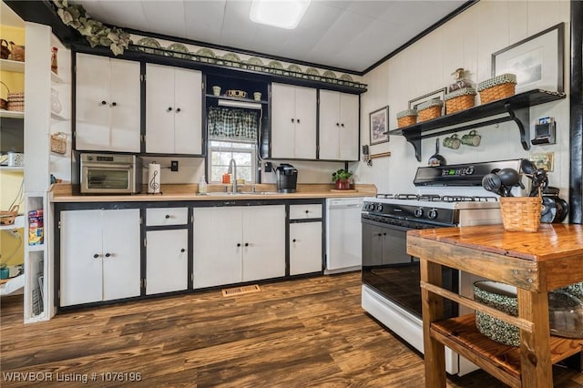 kitchen with dark hardwood / wood-style flooring, white cabinetry, sink, and white appliances