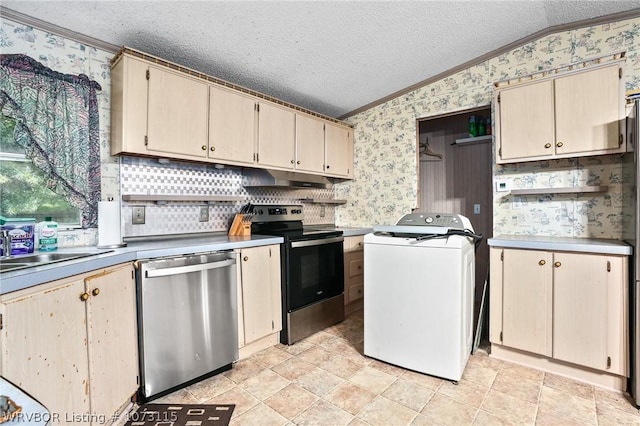 kitchen featuring lofted ceiling, ornamental molding, a textured ceiling, appliances with stainless steel finishes, and washer / dryer