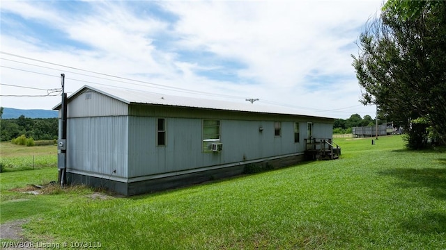 view of side of home featuring a yard