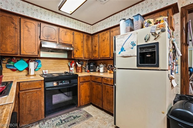 kitchen featuring sink, black range with electric cooktop, wall oven, white refrigerator with ice dispenser, and ornamental molding