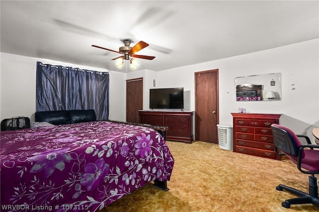 bedroom with ceiling fan and light colored carpet