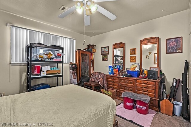 bedroom with ceiling fan and carpet