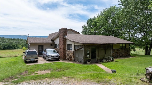 view of front of home with a front yard