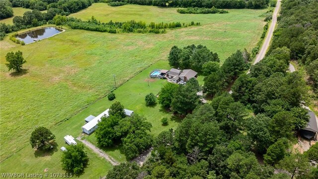 drone / aerial view with a water view and a rural view