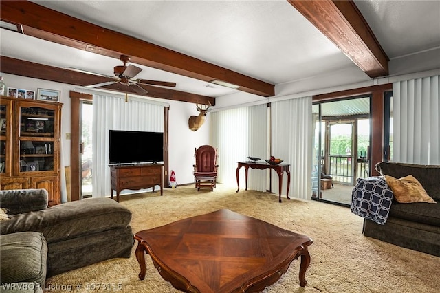 carpeted living room with beamed ceiling and ceiling fan