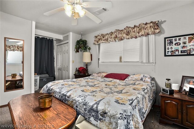 bedroom with a closet, dark carpet, and ceiling fan