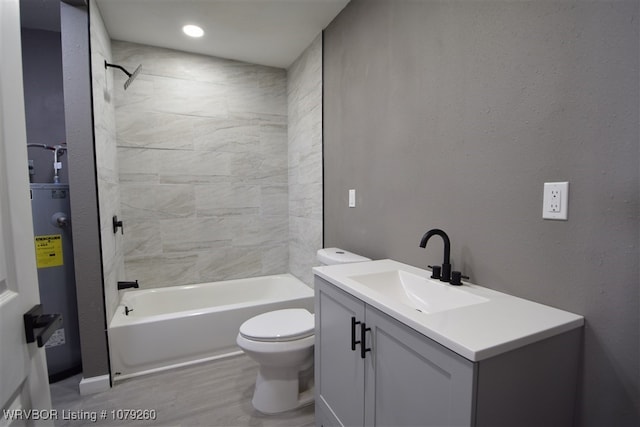 bathroom with a textured wall, toilet, electric water heater, shower / bath combination, and vanity