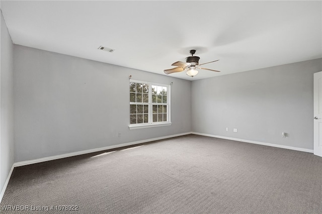 spare room with ceiling fan and carpet flooring