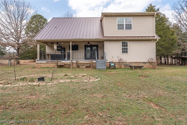 rear view of property with a porch and a lawn