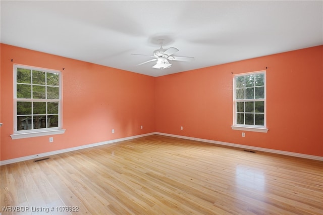 spare room featuring ceiling fan and light hardwood / wood-style floors