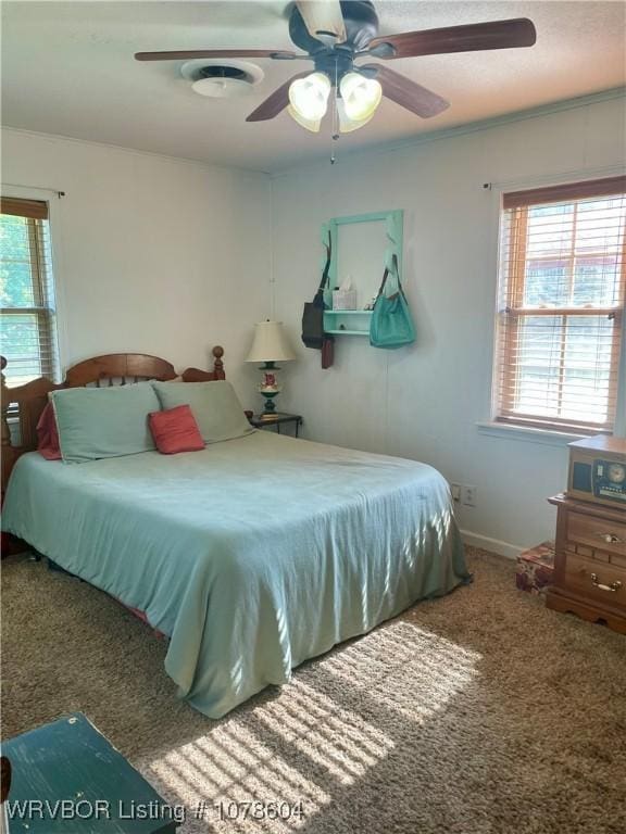 carpeted bedroom with ceiling fan