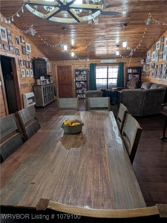 dining room with wood walls, wood ceiling, vaulted ceiling, and wood finished floors