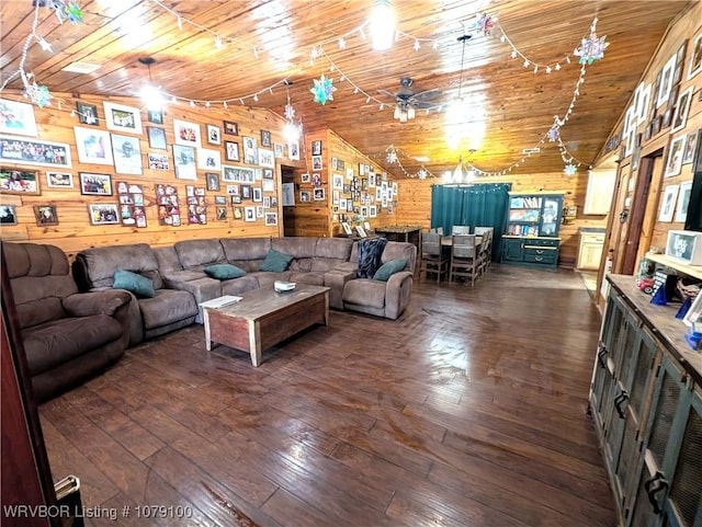 living area featuring wooden walls, wood ceiling, hardwood / wood-style floors, high vaulted ceiling, and a ceiling fan