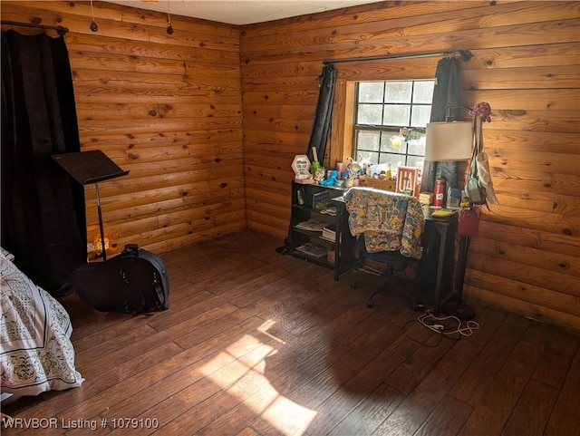 interior space with wood-type flooring and rustic walls