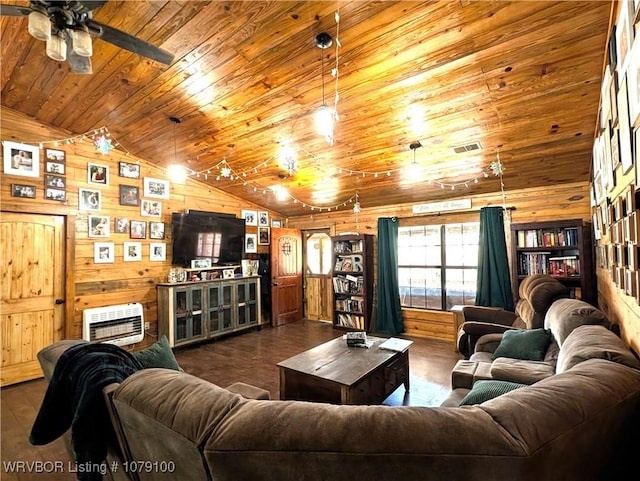 living room with wooden walls, heating unit, lofted ceiling, dark wood-type flooring, and wooden ceiling