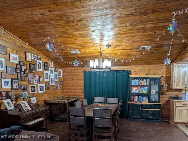 dining area featuring a notable chandelier, lofted ceiling, wooden walls, wood finished floors, and wooden ceiling