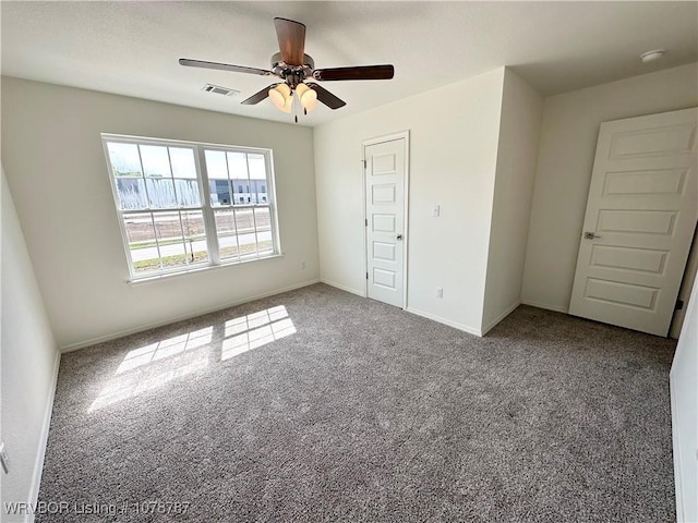 unfurnished bedroom featuring carpet and ceiling fan