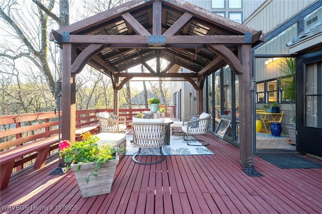wooden terrace featuring a gazebo